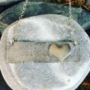 Saucy Jewelry textured pendant with heart