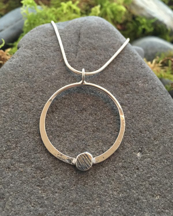 Saucy Jewelry circular luna pendant with textured metal