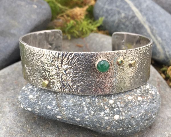 Saucy Jewelry reticulated cuff with emerald gemstone
