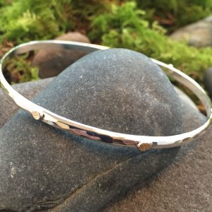 18k gold and sterling silver bangle by Saucy Jewelry