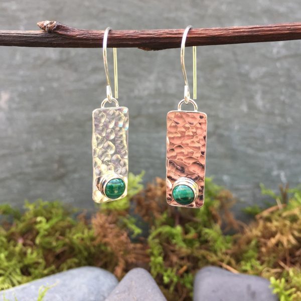 textured silver earrings with emeralds