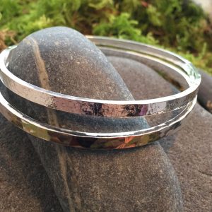 sterling silver textured bangles by Saucy Jewelry