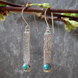 earrings by Saucy Jewelry topographical reticulation with gemstone